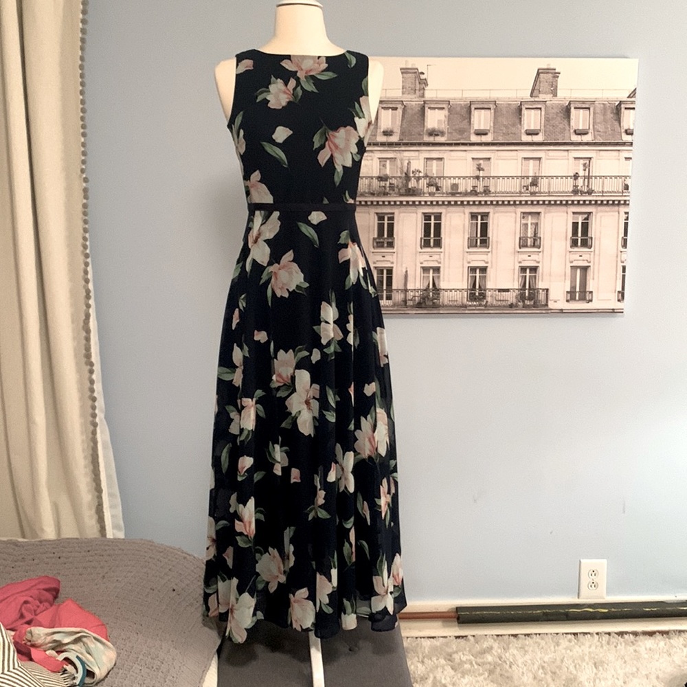 Fully lined mid length sleeveless floral fit and flare dress